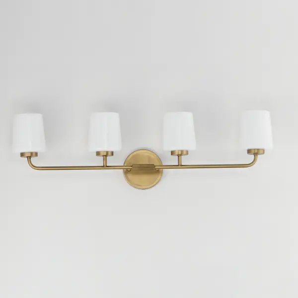 Featuring knurled rod details, this lighting collection brings a modern industrial edge to any space. Available in a range of sizes for chandeliers and two styles of bath vanity lighting, it offers versatility for different design needs. Offered in Matte Black, Satin Nickel, and Natural Aged Brass, this collection complements a wide variety of interior styles. Collection: Durham Finish: Natural Aged Brass Glass: White Width: 32.50" Height: 9.25" Weight: 8.20 lb Extension from Wall: 5.50" Wire: 8" Canopy: 5"x5" Number of Bulbs: 4 Maximum Wattage: 60.00 W Bulb Type: A19 Bulb Base: E26 Medium Light Source: Incandescent Dimmable Voltage: 120.00 V Material: Steel, Glass Safety Listing: cULus Safety Rating: Damp Spec Sheet Instructions - alternate view