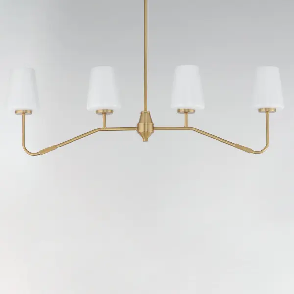 Featuring knurled rod details, this lighting collection brings a modern industrial edge to any space. Available in a range of sizes for chandeliers and two styles of bath vanity lighting, it offers versatility for different design needs. Offered in Matte Black, Satin Nickel, and Natural Aged Brass, this collection complements a wide variety of interior styles. Collection: Durham Finish: Natural Aged Brass Glass: White Width: 4.75" Height: 12.25" Length: 38.50" Weight: 6.82 lb Wire: 120" Canopy: 5.5"x5.5"x0.75" Number of Bulbs: 4 Maximum Wattage: 60.00 W Bulb Base: E26 Medium Light Source: Incandescent Dimmable Voltage: 120.00 V Material: Steel, Glass Safety Listing: cETLus Safety Rating: Dry Spec Sheet Instructions - alternate view
