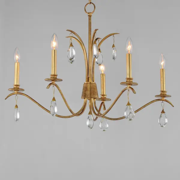 Eliciting a vision of natural beauty, the Eden collection is abundant with hand-crafted details from fabrication to finish. Bunched at the center of the chandelier, a collector features hand-wound wiring that groups a set of gracefully swooping arms that extend outward and branch upward in biophilic form. This coiling detail also suspends crystal adornments from the chandelier frame. Finished in an antiqued Charcoal Gold Leaf, the collection infuses rustic charm and refined simplicity. - alternate view