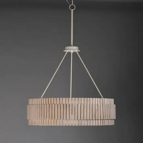 Crafted from sustainable bamboo, this lighting collection elevates the classic drum shade design with handcrafted, natural materials. The bamboo slats are thoughtfully spaced to allow light to filter through, creating a warm and inviting ambiance. Finished in a whitewashed, hand-brushed finish, both the pendant and coordinating sconce feature neutral tones that seamlessly complement a variety of interior styles. - alternate view