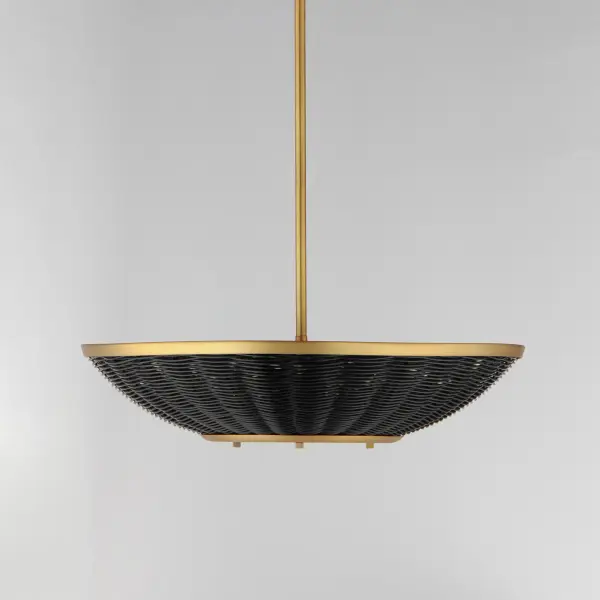 Hand-woven rattan is blackened and configured into a series of pendants and a dual-purpose wall sconce and flush mount. The blackened rattan is contrasted by a frame in Natural Aged Brass that adds a dramatic styling to the natural material. The overall effect is nostalgic, coastal, and yet transitional with a variety of design aesthetics. - alternate view