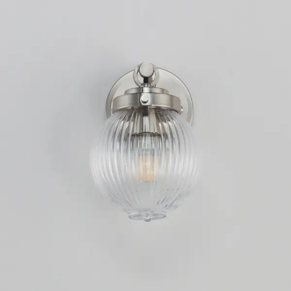 Nostalgic spherical glass volumes with a ribbed pattern and a dipped flat bottom, this collection offers a retro and eclectic choice for pendants and sconces. Available in Oil Rubbed Bronze, Satin Brass, and Satin Nickel, these fixtures provide elegant illumination, adding distinctive style to common spaces. Collection: Kasbah Finish: Satin Nickel Glass: Clear Ribbed Width: 6.00" Height: 9.00" Weight: 1.98 lb Extension from Wall: 7.75" Wire: 8" Canopy: 4.75"x4.75" Number of Bulbs: 1 Maximum Wattage: 60.00 W Bulb Type: A19 Bulb Base: E26 Medium Light Source: Incandescent Dimmable Voltage: 120.00 V Material: Steel, Glass Safety Listing: cETLus Safety Rating: Damp Spec Sheet Instructions - alternate view
