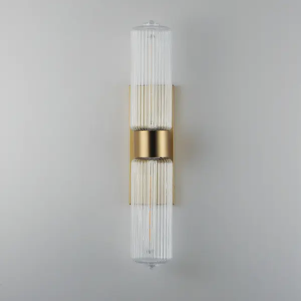 Nostalgic spherical glass volumes with a ribbed pattern and a dipped flat bottom, this collection offers a retro and eclectic choice for pendants and sconces. Available in Oil Rubbed Bronze, Satin Brass, and Satin Nickel, these fixtures provide elegant illumination, adding distinctive style to common spaces. Collection: Kasbah Finish: Satin Brass Glass: Clear Ribbed Width: 5.00" Height: 28.25" Weight: 6.06 lb Extension from Wall: 6.75" Wire: 8" Canopy: 13.75"x5" Number of Bulbs: 2 Maximum Wattage: 60.00 W Bulb Type: T10 Bulb Base: E26 Medium Light Source: Incandescent Dimmable Voltage: 120.00 V Material: Steel, Glass Safety Listing: cETLus Safety Rating: Damp Spec Sheet Instructions - alternate view