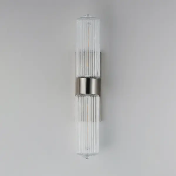 Nostalgic spherical glass volumes with a ribbed pattern and a dipped flat bottom, this collection offers a retro and eclectic choice for pendants and sconces. Available in Oil Rubbed Bronze, Satin Brass, and Satin Nickel, these fixtures provide elegant illumination, adding distinctive style to common spaces. Collection: Kasbah Finish: Satin Nickel Glass: Clear Ribbed Width: 5.00" Height: 28.25" Weight: 6.06 lb Extension from Wall: 6.75" Wire: 8" Canopy: 13.75"x5" Number of Bulbs: 2 Maximum Wattage: 60.00 W Bulb Type: T10 Bulb Base: E26 Medium Light Source: Incandescent Dimmable Voltage: 120.00 V Material: Steel, Glass Safety Listing: cETLus Safety Rating: Damp Spec Sheet Instructions - alternate view