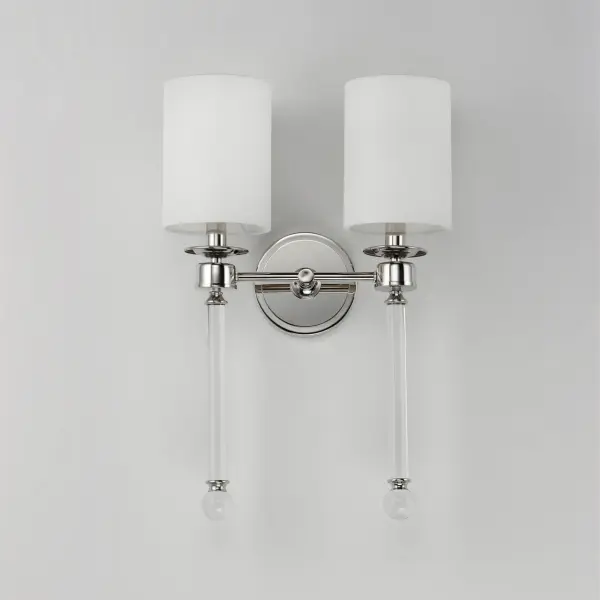 Unique and dramatic pendants are created using solid, Clear glass rods that fit into castings finished in Polished Nickel or Heritage Brass. The elongated forms are great for foyer spaces and stairways, while the sconces provide a chic accent to the space they are installed. Combining contemporary sleekness with classic styling, this collection complements a wide range of decor styles. Collection: Lucent Finish: Polished Nickel Glass: Clear Width: 13.75" Height: 21.00" Weight: 4.84 lb Extension from Wall: 6.75" Wire: 8" Number of Bulbs: 2 Maximum Wattage: 60.00 W Bulb Type: A19 Bulb Base: E12 Candelabra Light Source: Incandescent Dimmable Voltage: 120.00 V Material: Steel+Glass+Fabric Safety Listing: cETLus Safety Rating: Dry Spec Sheet Instructions Parts Diagram - alternate view