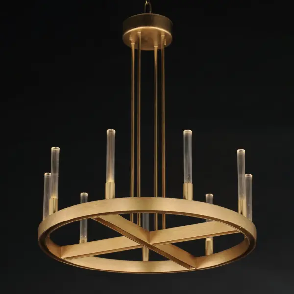 A modern tribute to the wheel chandelier, the Ovation collection integrates LED technology for a dazzling lighting effect. The LED light produces a shimmering lighting effect along the tall and narrow fluted glass shades adding celebratory effervescence. The expansive diameters of the rings join at the center in equipoise using four down rods to suspend the frame. Mount the chandelier from the collector or make use of additional chain supplied to extend the height with ease. Additional sconces with up and down lighting complete the design. Available in Brushed Brass or Black, the collection toasts a classic design creating an elegant statement. Collection: Ovation Finish: Gold Glass: Clear Ribbed Width: 23.50" Height: 26.50" Length: 23.50" Weight: 13.25 lb Chain: 36" Wire: 120" Canopy: 4.75"x4.75"x0.5" Bulbs Included Number of Bulbs: 9 Maximum Wattage: 2.00 W Bulb Type: LED Bulb Base: Integrated Light Source: LED Light Output: 900.00 lm Color Temperature: 3000 K CRI: 90 Rated Average Life: 50000 Voltage: 120.00 V Material: Steel, Ribbed Glass Safety Rating: Dry LED Spec Sheet Instructions - alternate view