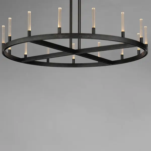 A modern tribute to the wheel chandelier, the Ovation collection integrates LED technology for a dazzling lighting effect. The LED light produces a shimmering lighting effect along the tall and narrow fluted glass shades adding celebratory effervescence. The expansive diameters of the rings join at the center in equipoise using four down rods to suspend the frame. Mount the chandelier from the collector or make use of additional chain supplied to extend the height with ease. Additional sconces with up and down lighting complete the design. Available in Brushed Brass or Black, the collection toasts a classic design creating an elegant statement. - alternate view