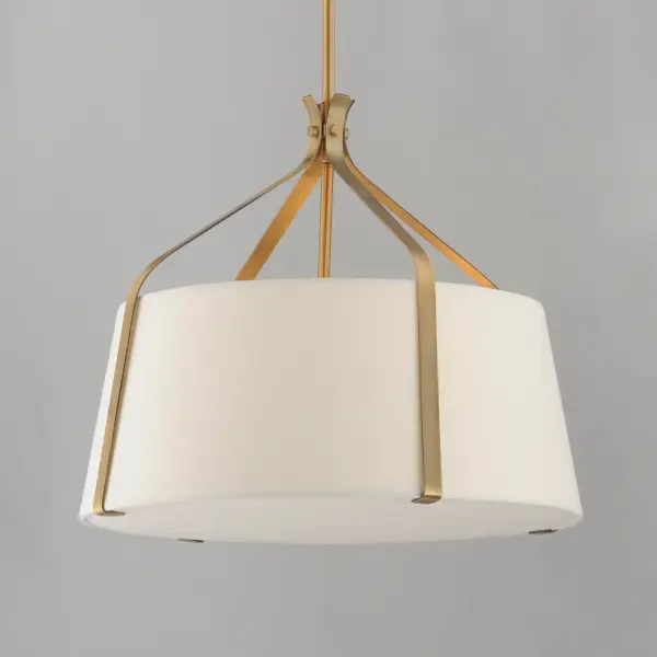 Inspired by timeless tailoring and architectural form, the Bandera collection reimagines the classic fabric shade pendant with refined, sculptural detail. A gracefully flared metal yoke suspends an elegant linen shade--offered in either Oatmeal with Dark Bronze or crisp White with Natural Aged Brass. A matching fabric diffuser on the larger pendants creates a soft, ambient glow ideal for dining areas, bedrooms, and entry spaces. The coordinating wall sconce extends the tailored aesthetic to more intimate settings, perfect for bedside or hallway installations. Balancing crisp geometry with warm texture, Bandera brings an elevated, transitional presence to interiors. Collection: Bandera Finish: Natural Aged Brass Width: 20.75" Height: 23.25" Length: 20.75" Weight: 9.30 lb Wire: 120" Canopy: 5"x5"x0.75" Number of Bulbs: 3 Maximum Wattage: 60.00 W Bulb Type: E26 Bulb Base: E26 Medium Light Source: Incandescent Voltage: 120.00 V Material: Steel,Cloth Safety Listing: cETLus Safety Rating: Dry Manufacturer Warranty: 3 Spec Sheet Instructions - alternate view