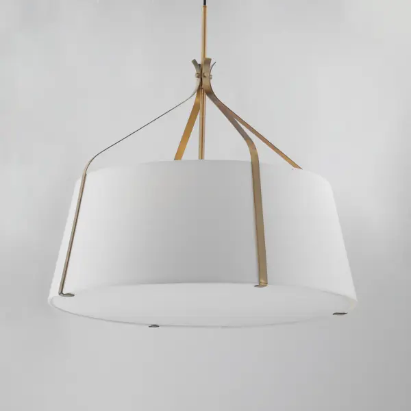 Inspired by timeless tailoring and architectural form, the Bandera collection reimagines the classic fabric shade pendant with refined, sculptural detail. A gracefully flared metal yoke suspends an elegant linen shade--offered in either Oatmeal with Dark Bronze or crisp White with Natural Aged Brass. A matching fabric diffuser on the larger pendants creates a soft, ambient glow ideal for dining areas, bedrooms, and entry spaces. The coordinating wall sconce extends the tailored aesthetic to more intimate settings, perfect for bedside or hallway installations. Balancing crisp geometry with warm texture, Bandera brings an elevated, transitional presence to interiors. Collection: Bandera Finish: Natural Aged Brass Width: 31.00" Height: 30.50" Length: 31.00" Weight: 16.20 lb Wire: 120" Canopy: 5"x5"x0.75" Number of Bulbs: 4 Maximum Wattage: 60.00 W Bulb Type: E26 Bulb Base: E26 Medium Light Source: Incandescent Voltage: 120.00 V Material: Steel,Cloth Safety Listing: cETLus Safety Rating: Dry Manufacturer Warranty: 3 Spec Sheet Instructions - alternate view