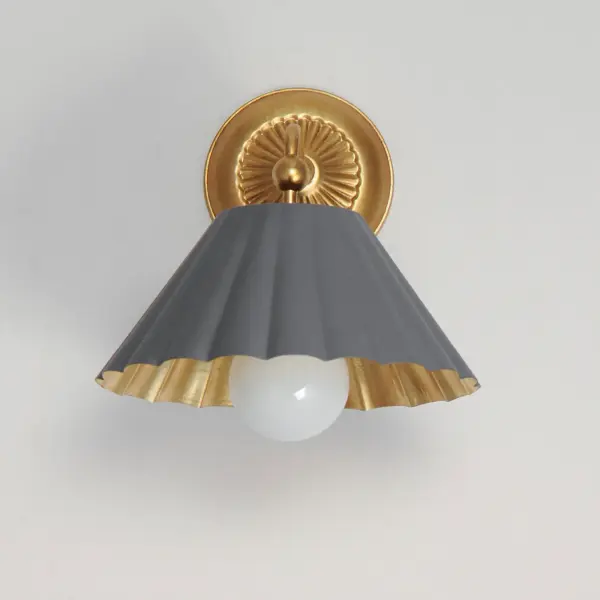 This refreshing collection features the nostalgic detailing of scalloped metal shades with gold leaf interiors. The hand applied gold-leaf interiors reflect the light source within the shades casting a warmer glow downwards. The collection is offered in charming chain hung pendants, a flush mount with Opal White schoolhouse glass, or oversized sconces. Available in Matte Black, Matte White, or Dark Grey with Gold leaf interiors and metalwork. Collection: Primrose Finish: Dark Grey / Gold Leaf Width: 10.00" Height: 11.00" Weight: 3.20 lb Extension from Wall: 12.00" Wire: 8" Canopy: 5.25"x5.25" Number of Bulbs: 1 Maximum Wattage: 60.00 W Bulb Type: E26 Bulb Base: E26 Medium Light Source: Incandescent Dimmable Voltage: 120.00 V Material: Steel Safety Listing: cETLus Safety Rating: Damp Spec Sheet Instructions - alternate view