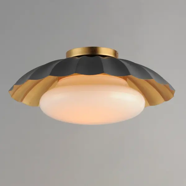 This refreshing collection features the nostalgic detailing of scalloped metal shades with gold leaf interiors. The hand applied gold-leaf interiors reflect the light source within the shades casting a warmer glow downwards. The collection is offered in charming chain hung pendants, a flush mount with Opal White schoolhouse glass, or oversized sconces. Available in Matte Black, Matte White, or Dark Grey with Gold leaf interiors and metalwork. Collection: Primrose Finish: Dark Grey / Gold Leaf Width: 16.00" Height: 6.75" Length: 16.00" Weight: 4.90 lb Wire: 8" Canopy: 5"x5"x0.75" Number of Bulbs: 1 Maximum Wattage: 60.00 W Bulb Type: E26 Bulb Base: E26 Medium Light Source: Incandescent Dimmable Voltage: 120.00 V Material: Steel, Glass Safety Listing: cETLus Safety Rating: Damp Spec Sheet Instructions - alternate view