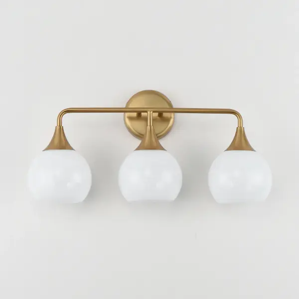 Featuring a swirling white Marble Glass globe that encases the light source, the shades are reminiscent of snowglobes. The collection provides a wonderfully wintery composition that is timelessly elegant effortlessly sophisticated. Choose from multiple sizes of the bath vanity lights as well as pendant configurations or two flush mount options. Available in Natural Aged Brass, Polished Chrome, or Matte Black. Collection: Neve Finish: Natural Aged Brass Glass: Marble Width: 22.50" Height: 10.75" Weight: 3.96 lb Extension from Wall: 6.50" Wire: 8" Canopy: 4.75"x4.75" Number of Bulbs: 3 Maximum Wattage: 60.00 W Bulb Base: E26 Medium Light Source: Incandescent Voltage: 120.00 V Material: Steel Safety Listing: cETLus Safety Rating: Damp Spec Sheet Instructions - alternate view