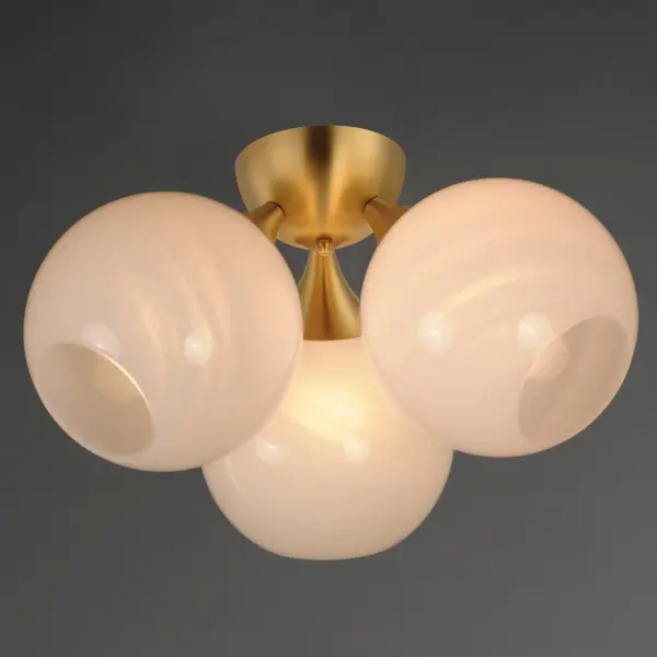 Featuring a swirling white Marble Glass globe that encases the light source, the shades are reminiscent of snowglobes. The collection provides a wonderfully wintery composition that is timelessly elegant effortlessly sophisticated. Choose from multiple sizes of the bath vanity lights as well as pendant configurations or two flush mount options. Available in Natural Aged Brass, Polished Chrome, or Matte Black. Collection: Neve Finish: Natural Aged Brass Glass: Marble Width: 18.75" Height: 10.50" Length: 18.75" Weight: 6.33 lb Wire: 10" Canopy: 5"x5"x2.5" Number of Bulbs: 3 Maximum Wattage: 60.00 W Bulb Type: E26 Bulb Base: E26 Medium Light Source: Incandescent Voltage: 120.00 V Material: Steel, glass Safety Listing: cETLus Safety Rating: Dry Manufacturer Warranty: 2 Spec Sheet Instructions - alternate view