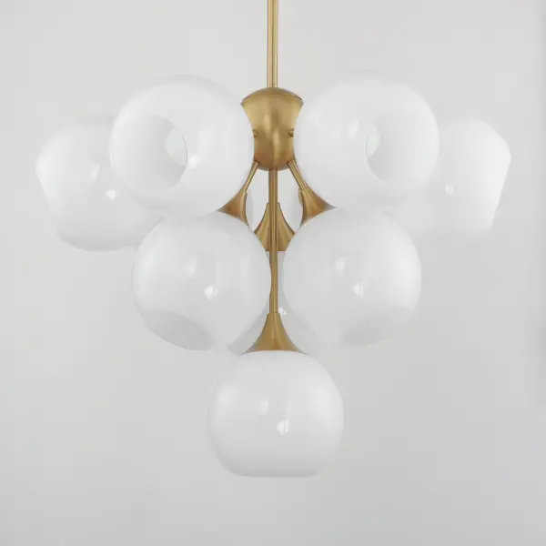 Featuring a swirling white Marble Glass globe that encases the light source, the shades are reminiscent of snowglobes. The collection provides a wonderfully wintery composition that is timelessly elegant effortlessly sophisticated. Choose from multiple sizes of the bath vanity lights as well as pendant configurations or two flush mount options. Available in Natural Aged Brass, Polished Chrome, or Matte Black. Collection: Neve Finish: Natural Aged Brass Glass: Marble Width: 27.50" Height: 21.25" Length: 27.50" Weight: 22.66 lb Wire: 120" Canopy: 5"x5"x0.75" Number of Bulbs: 10 Maximum Wattage: 60.00 W Bulb Type: E26 Bulb Base: E26 Medium Light Source: Incandescent Voltage: 120.00 V Material: Steel, glass Safety Listing: cETLus Safety Rating: Dry Manufacturer Warranty: 2 Spec Sheet Instructions - alternate view