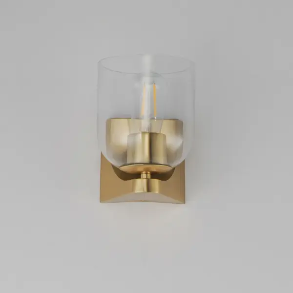 Cut-out metalwork curves around modern bell-shaped glass shades. The series includes pendants and bath vanities available in either Clear or a swirling Marble glass. Available in various complementary finishes: Polished Chrome, Matte Black, or Natural Aged Brass these fixtures make a delightful addition to bathroom spaces, bedrooms, or over a kitchen island. Collection: Scoop Finish: Natural Aged Brass Glass: Clear Width: 5.50" Height: 7.25" Weight: 1.98 lb Extension from Wall: 6.25" Wire: 6" Canopy: 4.75"x4.75" Number of Bulbs: 1 Maximum Wattage: 60.00 W Bulb Type: E26 Bulb Base: E26 Medium Light Source: Incandescent Dimmable Voltage: 120.00 V Material: Steel, Glass Safety Listing: cULus Safety Rating: Damp Manufacturer Warranty: 3 Spec Sheet Instructions - alternate view