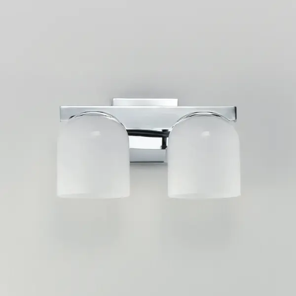 Cut-out metalwork curves around modern bell-shaped glass shades. The series includes pendants and bath vanities available in either Clear or a swirling Marble glass. Available in various complementary finishes: Polished Chrome, Matte Black, or Natural Aged Brass these fixtures make a delightful addition to bathroom spaces, bedrooms, or over a kitchen island. Collection: Scoop Finish: Polished Chrome Glass: Marble Width: 13.50" Height: 8.00" Weight: 4.84 lb Extension from Wall: 7.00" Wire: 6" Canopy: 5"x5" Number of Bulbs: 2 Maximum Wattage: 6.00 W Bulb Type: E26 Bulb Base: E26 Medium Light Source: LED Color Temperature: 27 K Dimmable Voltage: 120.00 V Material: Steel, Glass Safety Listing: cULus Safety Rating: Damp LED Spec Sheet Instructions - alternate view