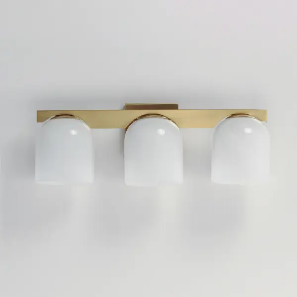 Cut-out metalwork curves around modern bell-shaped glass shades. The series includes pendants and bath vanities available in either Clear or a swirling Marble glass. Available in various complementary finishes: Polished Chrome, Matte Black, or Natural Aged Brass these fixtures make a delightful addition to bathroom spaces, bedrooms, or over a kitchen island. Collection: Scoop Finish: Natural Aged Brass Glass: Marble Width: 21.50" Height: 8.00" Weight: 6.60 lb Extension from Wall: 7.00" Wire: 6" Canopy: 5"x5" Number of Bulbs: 3 Maximum Wattage: 60.00 W Bulb Type: E26 Bulb Base: E26 Medium Light Source: Incandescent Dimmable Voltage: 120.00 V Material: Steel, Glass Safety Listing: cULus Safety Rating: Damp Spec Sheet Instructions - alternate view
