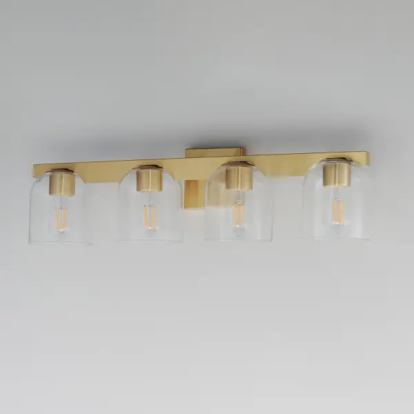 Cut-out metalwork curves around modern bell-shaped glass shades. The series includes pendants and bath vanities available in either Clear or a swirling Marble glass. Available in various complementary finishes: Polished Chrome, Matte Black, or Natural Aged Brass these fixtures make a delightful addition to bathroom spaces, bedrooms, or over a kitchen island. Collection: Scoop Finish: Natural Aged Brass Glass: Clear Width: 29.50" Height: 8.00" Weight: 8.80 lb Extension from Wall: 7.00" Wire: 6" Canopy: 5"x5" Number of Bulbs: 4 Maximum Wattage: 6.00 W Bulb Type: E26 Bulb Base: E26 Medium Light Source: LED Dimmable Voltage: 120.00 V Material: Steel, Glass Safety Listing: cULus Safety Rating: Damp LED Manufacturer Warranty: 3 Spec Sheet Instructions - alternate view