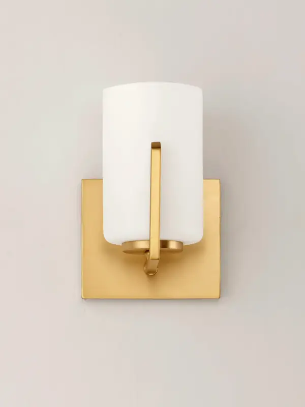 Inspired by the Modernist architect Edward Dart, this collection features straight line frames finished in Satin Brass, Satin Nickel, or Matte Black that support Satin White glass cylinders for a clean and modern look. The frames' ends turn up before the glass in sharp mitered angles emphasizing a minimalist geometry popular in Modernist work. Collection: Dart Finish: Satin Brass Glass: Satin White Width: 5.50" Height: 7.75" Weight: 1.36 lb Extension from Wall: 5.75" Wire: 8" Canopy: 4.75"x5.5" Number of Bulbs: 1 Maximum Wattage: 60.00 W Bulb Type: A19 Bulb Base: E26 Medium Light Source: Incandescent Dimmable Voltage: 120.00 V Material: Steel, Glass Safety Listing: cETLus Safety Rating: Damp Manufacturer Warranty: 3 Spec Sheet Instructions Parts Diagram - alternate view