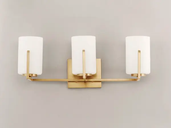 Inspired by the Modernist architect Edward Dart, this collection features straight line frames finished in Satin Brass, Satin Nickel, or Matte Black that support Satin White glass cylinders for a clean and modern look. The frames' ends turn up before the glass in sharp mitered angles emphasizing a minimalist geometry popular in Modernist work. Collection: Dart Finish: Satin Brass Glass: Satin White Width: 21.25" Height: 7.75" Length: 5.75" Weight: 3.04 lb Extension from Wall: 5.75" Wire: 8" Canopy: 4.75"x5.5" Number of Bulbs: 3 Maximum Wattage: 60.00 W Bulb Type: A19 Bulb Base: E26 Medium Light Source: Incandescent Dimmable Voltage: 120.00 V Material: Steel, Glass Safety Listing: cETLus Safety Rating: Damp Manufacturer Warranty: 3 Spec Sheet Instructions Parts Diagram - alternate view