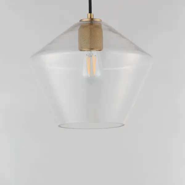 Crystalline clarity meets modern structure in the Geode collection. Inspired by the faceted symmetry of natural mineral formations, each clear glass shade is cut in an angular form that plays with light and shadow. The bold, geometric silhouette feels effortlessly architectural -- elevated further by subtle industrial notes like knurled screw collars and diamond shaped tubing on bath configurations. Offered in a range of sizes and finishes, Geode brings sculptural interest to kitchens, bathrooms, and dining rooms as well as statement-making entryways. Collection: Geode Finish: Natural Aged Brass Glass: Clear Width: 11.75" Height: 10.75" Weight: 3.30 lb Wire: 120" Canopy: 5"x5"x0.7" Number of Bulbs: 1 Maximum Wattage: 60.00 W Bulb Type: A19 Bulb Base: E26 Medium Light Source: Incandescent Voltage: 120.00 V Material: Steel, Glass Safety Listing: cULus Safety Rating: Dry Manufacturer Warranty: 3 Spec Sheet - alternate view