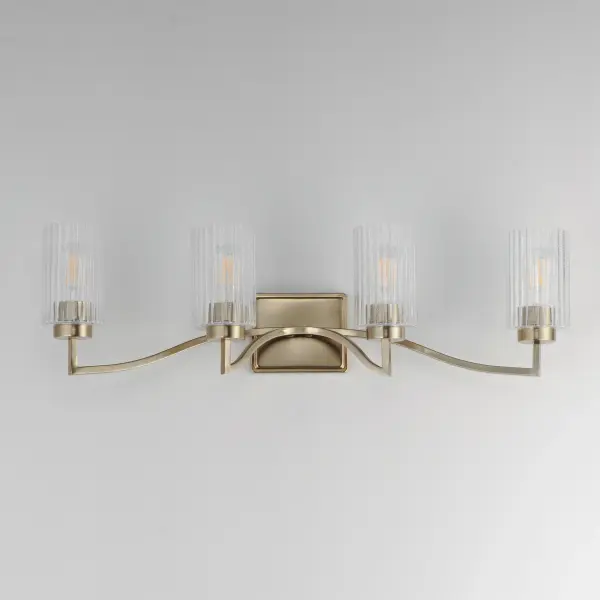 Clear Ribbed glass cylinders are supported on gracefully sweeping frames. The glass pattern helps to diffuse the light source while adding texture and style to the design. Available in Polished Nickel, Satin Champagne, or Matte Black. Collection: Rigata Finish: Satin Champagne Glass: Clear Ribbed Width: 32.25" Height: 9.00" Weight: 8.60 lb Extension from Wall: 5.75" Wire: 8" Canopy: 5"x6" Number of Bulbs: 4 Maximum Wattage: 60.00 W Bulb Type: A19 Bulb Base: E26 Medium Light Source: Incandescent Dimmable Voltage: 120.00 V Material: Steel, Glass Safety Listing: cULus Safety Rating: Damp Manufacturer Warranty: 3 Spec Sheet Instructions - alternate view