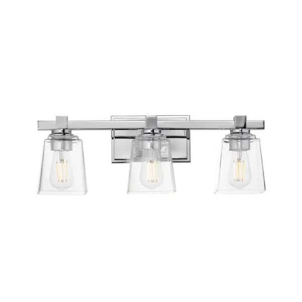 A composition of square forms that feature a Clear tapered square glass shade, these bath vanities provide a transitional design that suits both modern and traditional spaces. Available in Matte Black, Polished Chrome, Satin Nickel, and Natural Aged Brass. Collection: Cubos Finish: Polished Chrome Glass: Clear Width: 22.25" Height: 8.00" Weight: 6.30 lb Extension from Wall: 6.00" Wire: 8" Canopy: 4.75"x7.75" Number of Bulbs: 3 Maximum Wattage: 60.00 W Bulb Type: A19 Bulb Base: E26 Medium Light Source: Incandescent Dimmable Voltage: 120.00 V Material: Steel, Glass Safety Listing: cULus Safety Rating: Damp Manufacturer Warranty: 3 Spec Sheet Instructions