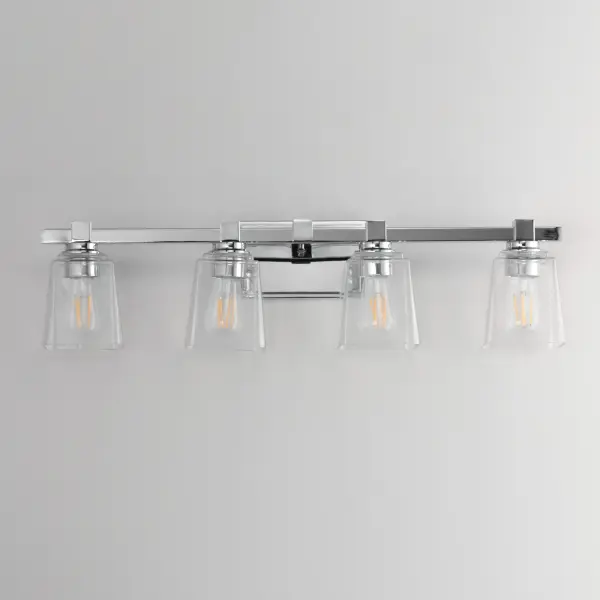 A composition of square forms that feature a Clear tapered square glass shade, these bath vanities provide a transitional design that suits both modern and traditional spaces. Available in Matte Black, Polished Chrome, Satin Nickel, and Natural Aged Brass. Collection: Cubos Finish: Polished Chrome Glass: Clear Width: 30.75" Height: 8.00" Weight: 8.60 lb Extension from Wall: 6.00" Wire: 8" Canopy: 4.75"x7.75" Number of Bulbs: 4 Maximum Wattage: 60.00 W Bulb Type: A19 Bulb Base: E26 Medium Light Source: Incandescent Dimmable Voltage: 120.00 V Material: Steel, Glass Safety Listing: cULus Safety Rating: Damp Manufacturer Warranty: 3 Spec Sheet Instructions - alternate view