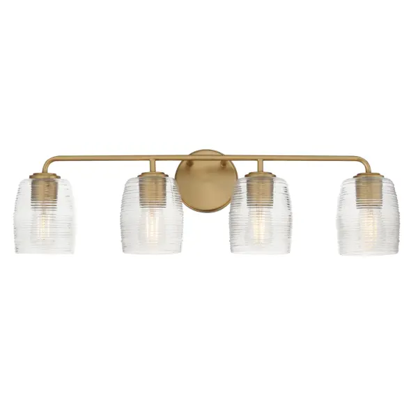 Warm and subtly nostalgic, the Honey collection draws inspiration from vintage honey jars and the familiar grooves of wooden dippers. Delicate ribbing on the clear glass shades plays with the light, creating gentle refractions that echo the soft sweetness of its namesake. Finished in either hand-brushed Kentucky Bronze or Natural Aged Brass, the frame brings an inviting glow that suits both traditional and contemporary settings. Honey lends an effortless charm to vanities, powder rooms, or anywhere you want a little golden-hour warmth--any time of day. Collection: Honey Finish: Natural Aged Brass Glass: Clear Ribbed Width: 30.50" Height: 8.25" Weight: 7.30 lb Extension from Wall: 6.00" Wire: 8" Canopy: 5"x5" Number of Bulbs: 4 Maximum Wattage: 60.00 W Bulb Type: A19 Bulb Base: E26 Medium Light Source: Incandescent Voltage: 120.00 V Material: Steel, Glass Safety Listing: cULus Safety Rating: Damp Manufacturer Warranty: 3 Spec Sheet