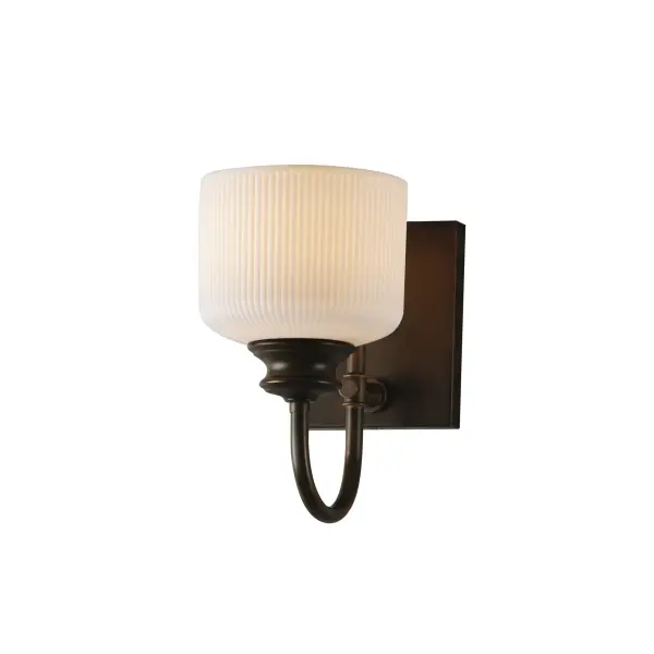 Ribbed ceramic shades are gracefully suspended on classic arching tube frames, creating a timeless yet modern design. The matte bisque-fired ceramic is translucent softly diffuses light while highlighting the ribbed raised pattern. Available in elegant finishes, choose from Natural Aged Brass, Oil Rubbed Bronze, or Polished Nickel frames to complement your space. Collection: Bisque Finish: Oil Rubbed Bronze Glass: White Width: 5.50" Height: 10.00" Weight: 2.20 lb Extension from Wall: 9.00" Wire: 8" Canopy: 6"x4.75" Number of Bulbs: 1 Maximum Wattage: 60.00 W Bulb Base: E26 Medium Light Source: Incandescent Dimmable Voltage: 120.00 V Material: Steel, Glass Safety Listing: cETLus Safety Rating: Damp Spec Sheet Instructions