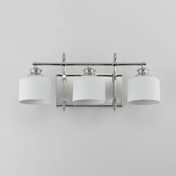 Ribbed ceramic shades are gracefully suspended on classic arching tube frames, creating a timeless yet modern design. The matte bisque-fired ceramic is translucent softly diffuses light while highlighting the ribbed raised pattern. Available in elegant finishes, choose from Natural Aged Brass, Oil Rubbed Bronze, or Polished Nickel frames to complement your space. Collection: Bisque Finish: Polished Nickel Glass: White Width: 24.00" Height: 10.00" Weight: 6.38 lb Extension from Wall: 9.00" Wire: 8" Canopy: 6"x12" Number of Bulbs: 3 Maximum Wattage: 60.00 W Bulb Base: E26 Medium Light Source: Incandescent Dimmable Voltage: 120.00 V Material: Steel, Glass Safety Listing: cETLus Safety Rating: Damp Spec Sheet Instructions - alternate view