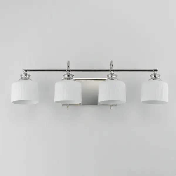 Ribbed ceramic shades are gracefully suspended on classic arching tube frames, creating a timeless yet modern design. The matte bisque-fired ceramic is translucent softly diffuses light while highlighting the ribbed raised pattern. Available in elegant finishes, choose from Natural Aged Brass, Oil Rubbed Bronze, or Polished Nickel frames to complement your space. Collection: Bisque Finish: Polished Nickel Glass: White Width: 32.00" Height: 10.00" Weight: 7.48 lb Extension from Wall: 9.00" Wire: 8" Canopy: 6"x12" Number of Bulbs: 4 Maximum Wattage: 60.00 W Bulb Base: E26 Medium Light Source: Incandescent Dimmable Voltage: 120.00 V Material: Steel, Glass Safety Listing: cETLus Safety Rating: Damp Spec Sheet Instructions - alternate view