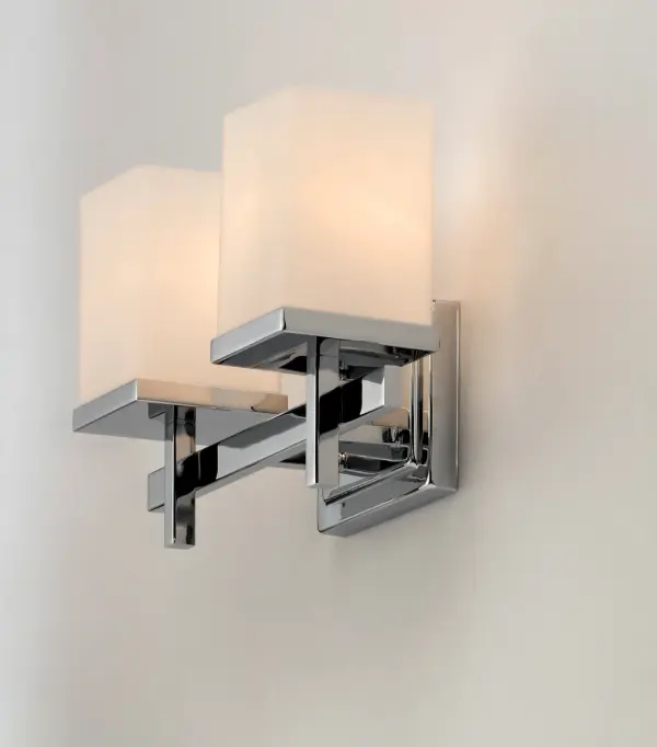 Square glass shades ride upon a rectangular bar to create geometry at its best. Available in Polished Chrome with Satin White glass and Satin Nickel and white Linen glass. Collection: Tetra Finish: Polished Chrome Glass: Satin White Width: 14.00" Height: 9.00" Weight: 4.37 lb Extension from Wall: 6.00" Canopy: 4.75"x6.5" Number of Bulbs: 2 Maximum Wattage: 60.00 W Bulb Type: A19 Bulb Base: E26 Medium Light Source: Incandescent Dimmable Voltage: 120.00 V Material: Steel, Glass Safety Listing: cETLus Safety Rating: Damp Manufacturer Warranty: 1 Spec Sheet Instructions Parts Diagram - alternate view