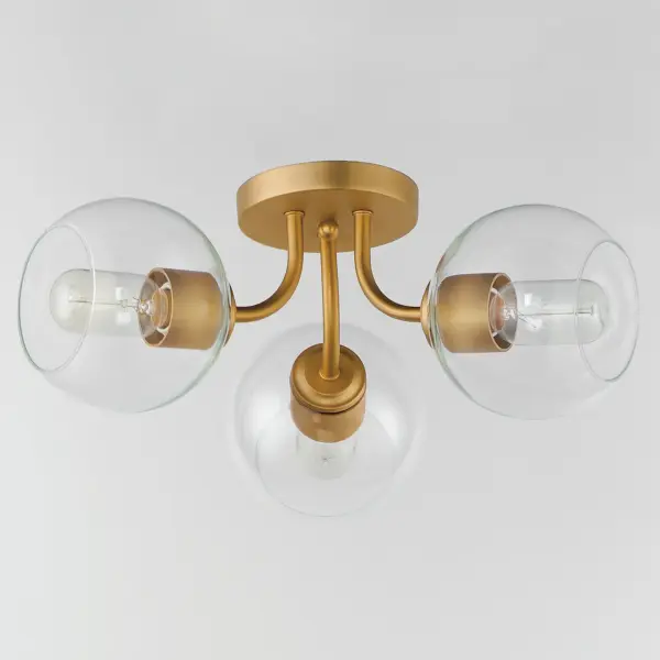Clear glass globes on a Natural Aged Brass frame create a transitional design that is sure to please. The sloping arms level out to create a simple Mid Century Modern configuration. A full range of the products in this collection include chandeliers, pendants, flush mounts, and sconces. Collection: Knox Finish: Natural Aged Brass Glass: Clear Width: 18.00" Height: 7.50" Length: 18.00" Weight: 3.30 lb Wire: 8" Canopy: 5"x5"x0.75" Number of Bulbs: 3 Maximum Wattage: 60.00 W Bulb Type: E26 Bulb Base: E26 Medium Light Source: Incandescent Dimmable Voltage: 120.00 V Material: Steel,Glass Safety Listing: cETLus Safety Rating: Dry Manufacturer Warranty: 2 Spec Sheet Instructions - alternate view