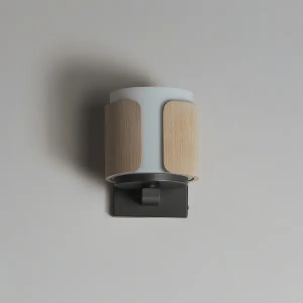 Inspired by the precision and artistry of classic millwork, Draughtsman fuses refined materials with a tailored silhouette to deliver an elevated lighting solution rooted in craftsmanship. Sculpted wood panels form an open cylindrical frame, flared slightly at the base for a gentle curve that evokes artisan joinery. A Satin White glass diffuser softly disperses light downward, grounding the form with warmth and clarity. Offered in two finish combinations--rich Walnut with matte Black or Whitewashed Oak with Charcoal--this collection brings a handsome, architectural touch to transitional and traditional interiors alike. - alternate view