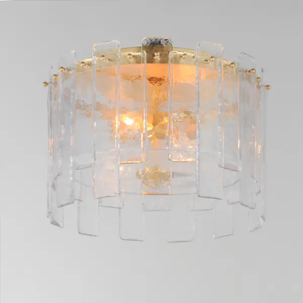 Gracefully flowing molten glass panels with uniquely organic aesthetic encircle rings of rich Darkened Bronze metal or hand-applied Gold Leaf. This refined interpretation of tiered glass pendants exudes warmth and elegance, effortlessly blending a moody ambiance with timeless contemporary charm. Available in a variety of pendant configurations as well as coordinating wall sconce and semi-flush mount. Collection: Warren Finish: Gold Leaf Glass: Artisan Width: 14.50" Height: 10.00" Length: 14.50" Weight: 18.04 lb Wire: 8" Canopy: 10"x10"x1" Number of Bulbs: 2 Maximum Wattage: 60.00 W Bulb Base: E12 Candelabra Light Source: Incandescent Dimmable Voltage: 120.00 V Material: Steel, Glass Safety Listing: cETLus Safety Rating: Dry Spec Sheet Instructions - alternate view