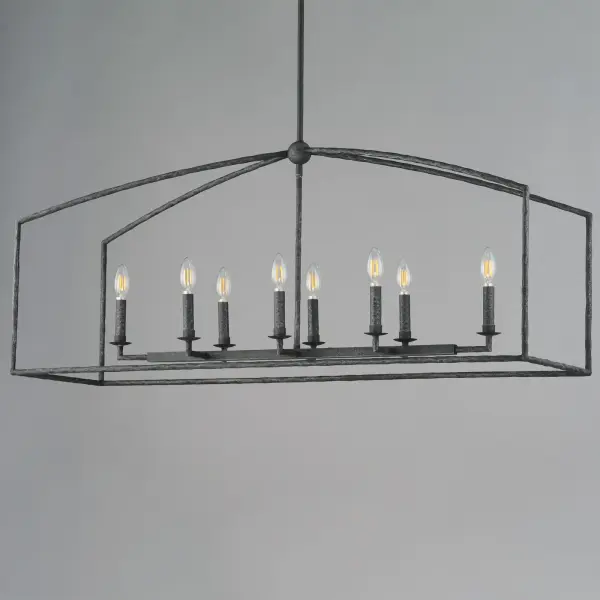 Rooted in traditional European ironwork but reimagined for modern spaces, the Martel collection elevates the classic lantern with hand-forged artistry and stripped-down elegance. A sculptural hammered iron frame arcs gracefully to define the open silhouette, while simple candelabra sockets and 90-degree hammered candle sleeves emphasize light, shadow, and raw materiality. With no glass or shades, the clean construction highlights the organic hand-hammered texture and allows the glow of candlelight to radiate freely. Available in a warm Etruscan Gold or moody Blacksmith finish, Martel brings a refined yet rustic sensibility to entryways, kitchens, or living spaces. - alternate view