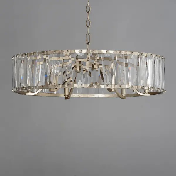 Boldly beveled tapered glass panels are arranged around a metal frame finished in either Black or elegant Golden Silver. Evocative of an earlier era, the glitz and glamor of the Odeon collection is a timeless choice for your interiors. Transform the look with the coordinating Fandelight option that integrates Wifi-enabled functions to operate the fan and lighting. Collection: Odeon Finish: Golden Silver Glass: Beveled Crystal Width: 26.75" Height: 9.50" Weight: 19.84 lb Chain: 36" Wire: 120" Canopy: 5.875"x5.875"x1" Number of Bulbs: 6 Maximum Wattage: 60.00 W Bulb Type: Candelabra Bulb Base: E12 Candelabra Light Source: Incandescent Voltage: 120.00 V Material: Steel,Crystal Safety Rating: Dry Manufacturer Warranty: 3 Spec Sheet Instructions - alternate view