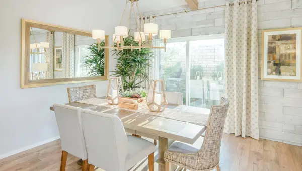 Arched channels of metal finished in your choice of Natural Aged Brass or Polished Nickel, form this minimalistic approach to traditional lighting.  Oatmeal fabric shades adorn the top of metal candle covers that give this collection a tailored look. - alternate view