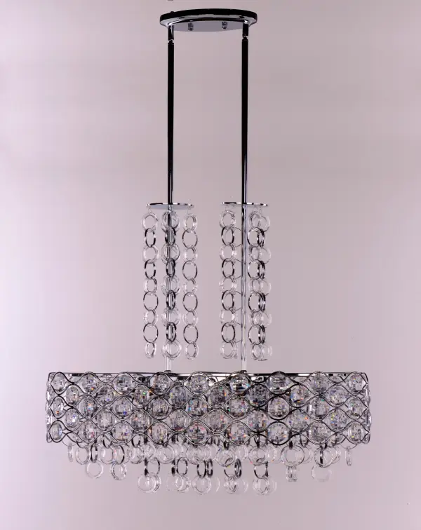 Chains of faceted crystal rings are linked together by Polished Chrome jewelry bands that cascade from the top and through the fixture. The exterior shade of wave-like metal encases multi-faceted Beveled Crystal jewels, which sparkle from the light of the Xenon lamps included with each fixture. - alternate view