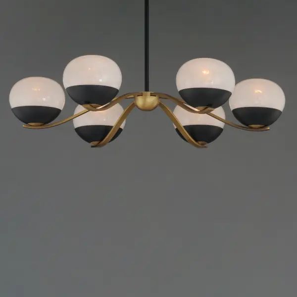 Notably stylish and unique, the Lucerne collection features oblong glossy glass globes with a swirling Marble pattern that exudes sophistication. The distinctive rectangular arms gracefully curve downward, seamlessly blending robust metal fabrication with precision and fluid elegance. Contrasting Black and Natural Aged Brass finishes accentuate the bobeches, adding depth and visual intrigue. Offering versatile installation options, the chandelier can be suspended by a sleek stem or the chain included for various height adjustment. - alternate view