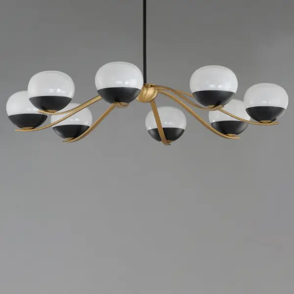 Notably stylish and unique, the Lucerne collection features oblong glossy glass globes with a swirling Marble pattern that exudes sophistication. The distinctive rectangular arms gracefully curve downward, seamlessly blending robust metal fabrication with precision and fluid elegance. Contrasting Black and Natural Aged Brass finishes accentuate the bobeches, adding depth and visual intrigue. Offering versatile installation options, the chandelier can be suspended by a sleek stem or the chain included for various height adjustment. - alternate view