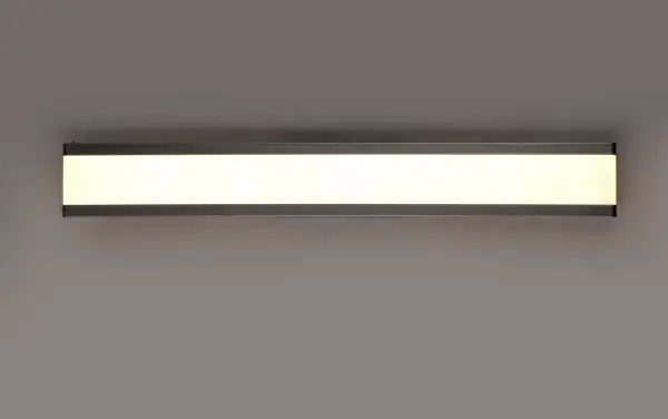Dual Black aluminum channels support a Frost acrylic diffuser that projects light into the room when illuminated. Available in 4 lengths, this collection can be installed horizontal above the mirror or vertical on each side. - alternate view