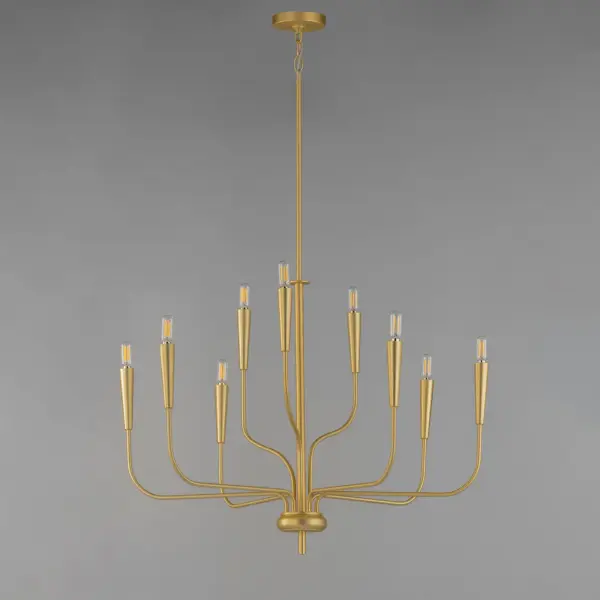 A simple candle style chandelier is given a modern edge with tall tapered candle covers that sit at the ends of curved arms without a bobeche beneath them. Available in Satin Brass or Matte Black, the collection compliments many architectural interiors and allows for creative styling through the selection of lamp type. Pair with our T6 lamp for more modern, industrial flair or classic candelabra for a clean, transitional look. This series provides a convenient new take on the candle chandelier with subtle and unique design details. Collection: Vela Finish: Satin Brass Width: 32.00" Height: 24.00" Length: 32.00" Weight: 6.65 lb Wire: 120" Canopy: 4.75"x4.75"x0.75" Number of Bulbs: 9 Maximum Wattage: 60.00 W Bulb Type: B10 - T6 - G16.5 Bulb Base: E12 Candelabra Light Source: Incandescent Voltage: 120.00 V Material: Steel Safety Rating: Dry Spec Sheet Instructions - alternate view