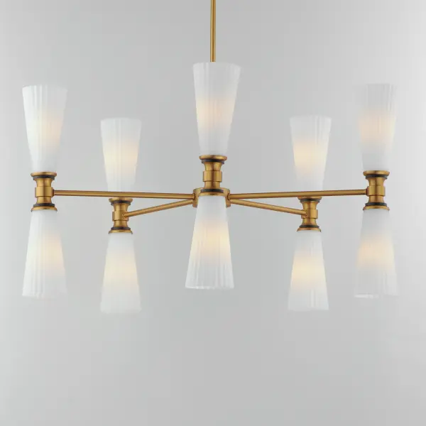 Fluted Satin White glass flares outward from an intricate and thin arm. The contrasting Natural Aged Brass and Matte Black finish adds character to the simple and stately fixtures that easily transition from modern and more traditional spaces. - alternate view