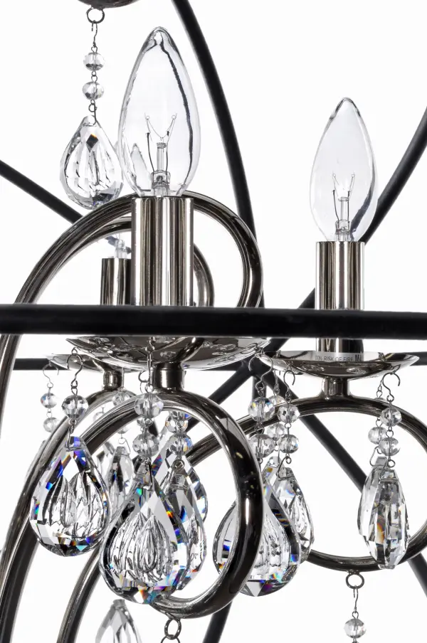 A spherical frame of metal surround a simple line chandelier draped in crystal for a transitional style that fits any interior design.  Orbit is available in 2 sizes and 2 finishes, Oil Rubbed Bronze with Cognac crystal and a combo finish of Anthracite and Polished Nickel with Clear crystal. - alternate view