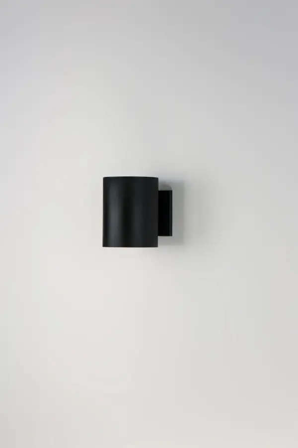 The Outpost is a classic cylinder light which provides directional illumination without glare. Available in 3 sizes, the 2 light version has both up and down lighting, while the singular light has 1 direction lighting. Available in Architectural Bronze, Aluminum, or Black. Collection: Outpost Finish: Black Width: 5.00" Height: 7.25" Weight: 1.76 lb Extension from Wall: 6.25" Wire: 8" Canopy: 5"x4.5" Number of Bulbs: 1 Maximum Wattage: 40.00 W Bulb Type: A19 Bulb Base: E26 Medium Light Source: Incandescent Light Output: 480.00 lm Voltage: 120.00 V Material: Aluminum Safety Listing: cETLus Safety Rating: Wet Dark Sky Manufacturer Warranty: 2 Spec Sheet Instructions Parts Diagram - alternate view
