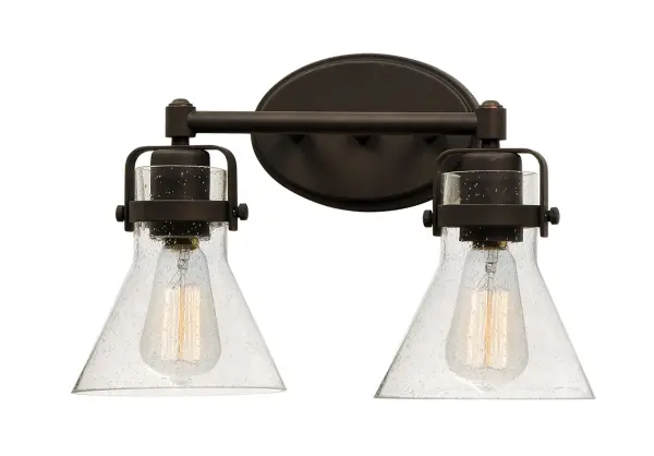 This nautical-inspired collection features Clear Seedy glass cones suspended by a yoke frame. The clear glass offers abundant lighting and compliments the styling of the fixture. Make it a more industrial look by adding filament E26 light bulbs. Collection: Seafarer Finish: Oil Rubbed Bronze Glass: Seedy Width: 15.00" Height: 10.00" Weight: 4.18 lb Extension from Wall: 7.00" Wire: 8" Canopy: 4.5"x7" Number of Bulbs: 2 Maximum Wattage: 60.00 W Bulb Type: A19 Bulb Base: E26 Medium Light Source: Incandescent Dimmable Voltage: 120.00 V Material: Steel, Glass Safety Listing: cETLus Safety Rating: Damp Manufacturer Warranty: 1 Spec Sheet Instructions Parts Diagram