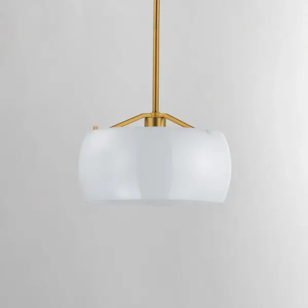 Balancing sculptural form with a soft, luminous finish, the Glazed collection brings elevated ease to transitional interiors. Each piece features rounded rings of glossy white glass, thoughtfully proportioned to diffuse light with a gentle, even glow. A minimalist metal frame in either Natural Aged Brass or Matte Black adds quiet structure and a hint of contrast. Available in chandeliers, pendants, and flush mounts, Glazed offers a clean, contemporary update to classic silhouettes--perfect for kitchens, dining areas, and intimate gathering spaces. Collection: Glazed Finish: White/Natural Aged Brass Width: 11.00" Height: 6.50" Length: 11.00" Weight: 3.96 lb Wire: 120" Canopy: 5"x5"x0.75" Number of Bulbs: 1 Maximum Wattage: 60.00 W Bulb Type: E26 Bulb Base: E26 Medium Light Source: Incandescent Voltage: 120.00 V Material: Steel, Glass Safety Listing: cETLus Safety Rating: Dry Manufacturer Warranty: 2 Spec Sheet - alternate view