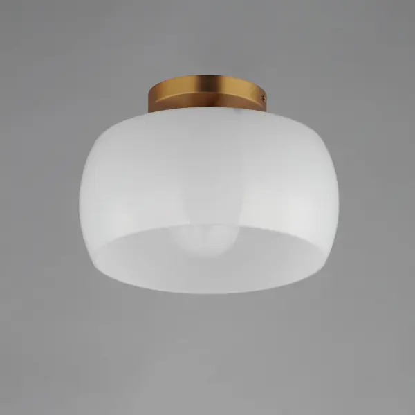 Balancing sculptural form with a soft, luminous finish, the Glazed collection brings elevated ease to transitional interiors. Each piece features rounded rings of glossy white glass, thoughtfully proportioned to diffuse light with a gentle, even glow. A minimalist metal frame in either Natural Aged Brass or Matte Black adds quiet structure and a hint of contrast. Available in chandeliers, pendants, and flush mounts, Glazed offers a clean, contemporary update to classic silhouettes--perfect for kitchens, dining areas, and intimate gathering spaces. Collection: Glazed Finish: White/Natural Aged Brass Width: 11.00" Height: 7.50" Length: 11.00" Weight: 2.86 lb Wire: 8" Canopy: 5"x5"x0.75" Number of Bulbs: 1 Maximum Wattage: 60.00 W Bulb Type: E26 Bulb Base: E26 Medium Light Source: Incandescent Voltage: 120.00 V Material: Steel, Glass Safety Listing: cETLus Safety Rating: Damp Manufacturer Warranty: 2 Spec Sheet - alternate view